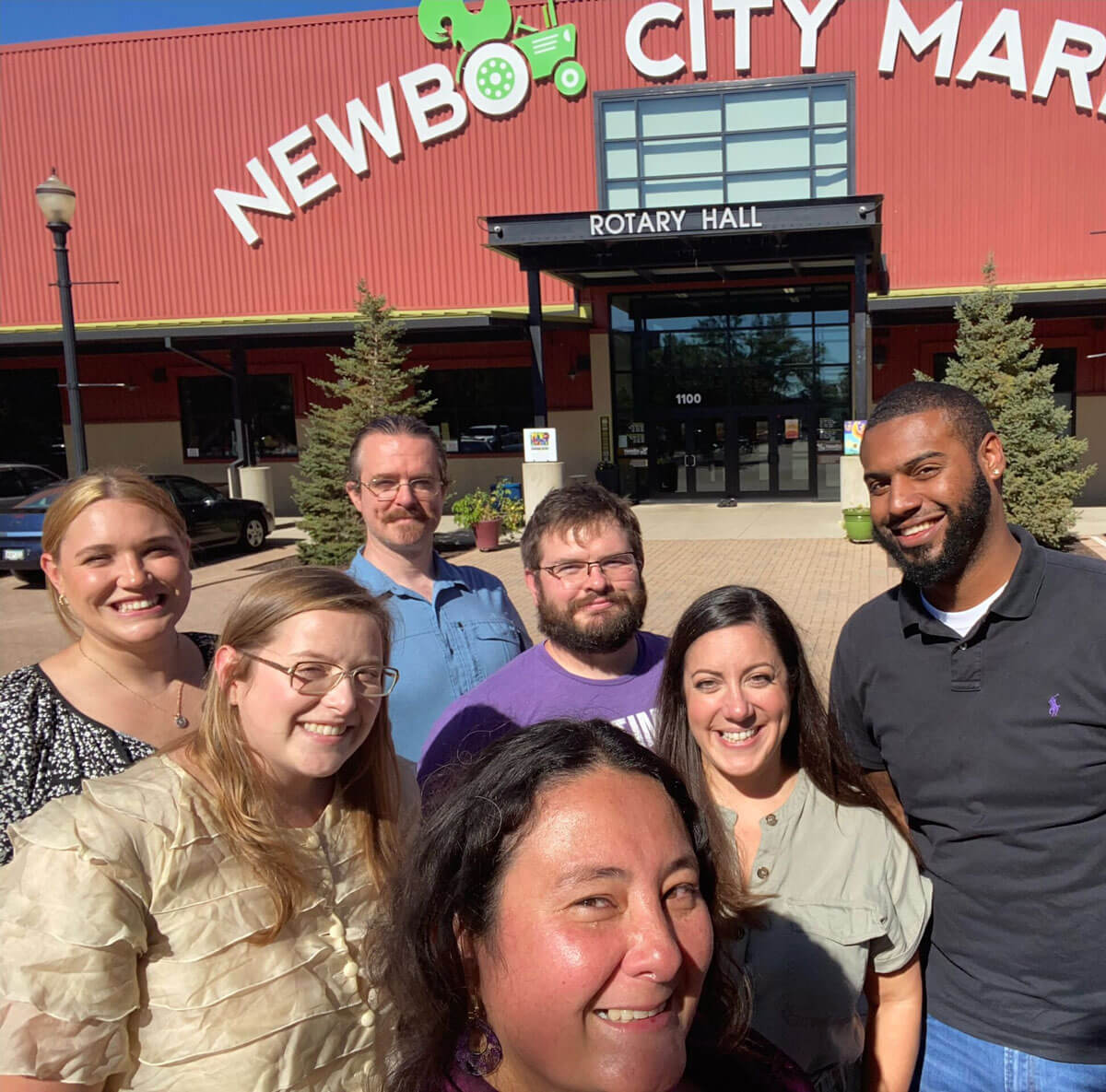 NewBo City Market staff stands outside of the front of the NewBo City Market